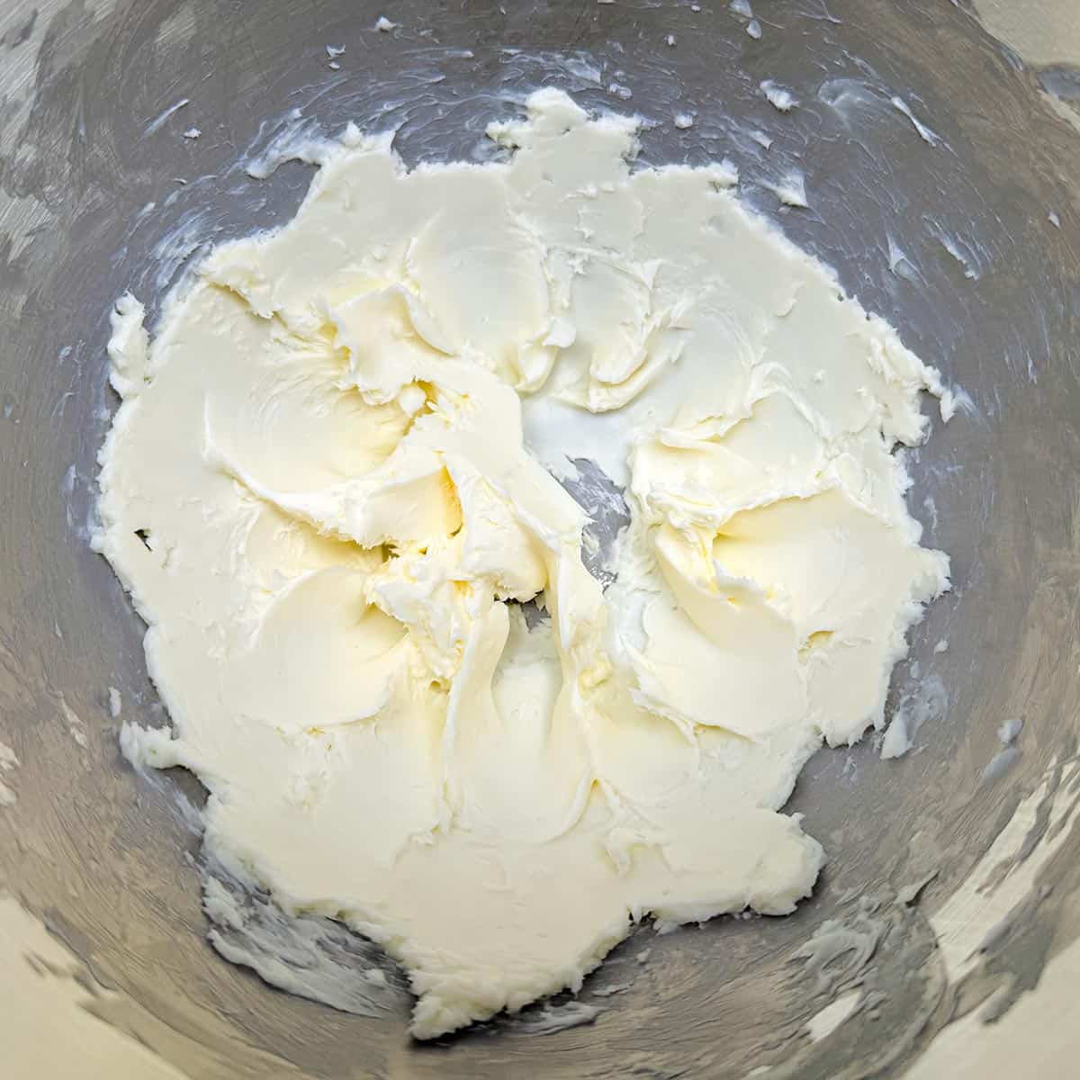 Creamed butter in a mixer bowl.