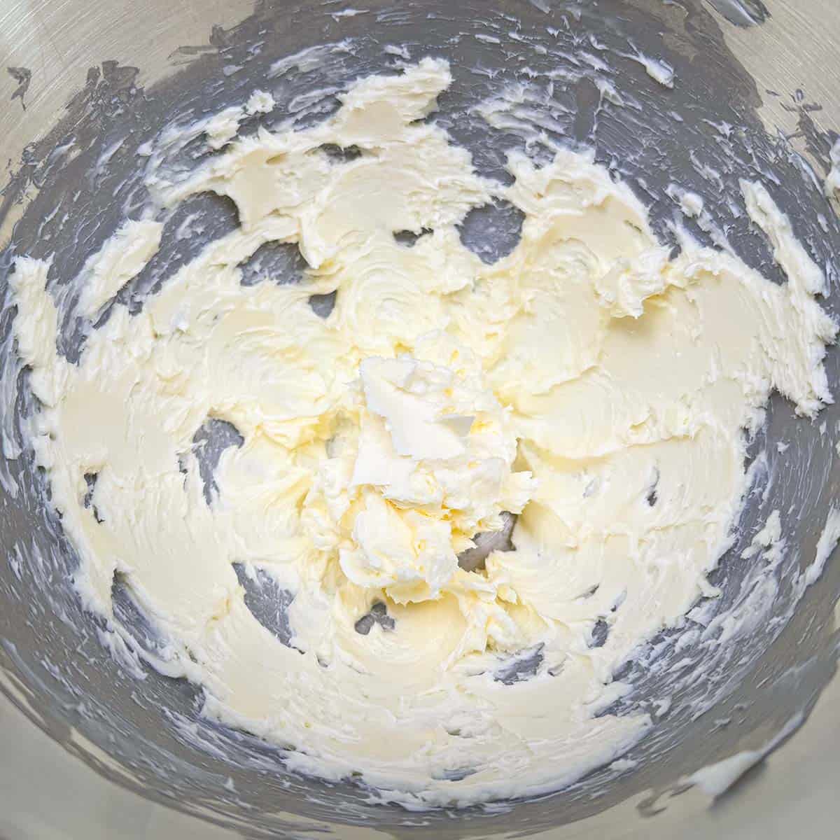 Creamed butter in a mixer bowl.
