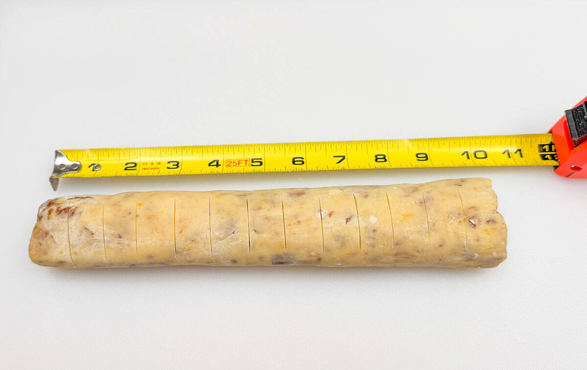 Showing the score lines on the chilled log so they know where to cut the cookies.