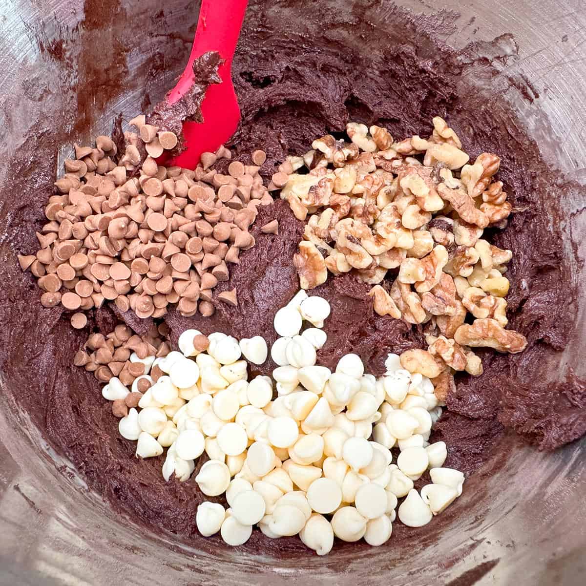 Finishing the cookie dough with the white chocolate and caramel chips along with the chopped walnuts.