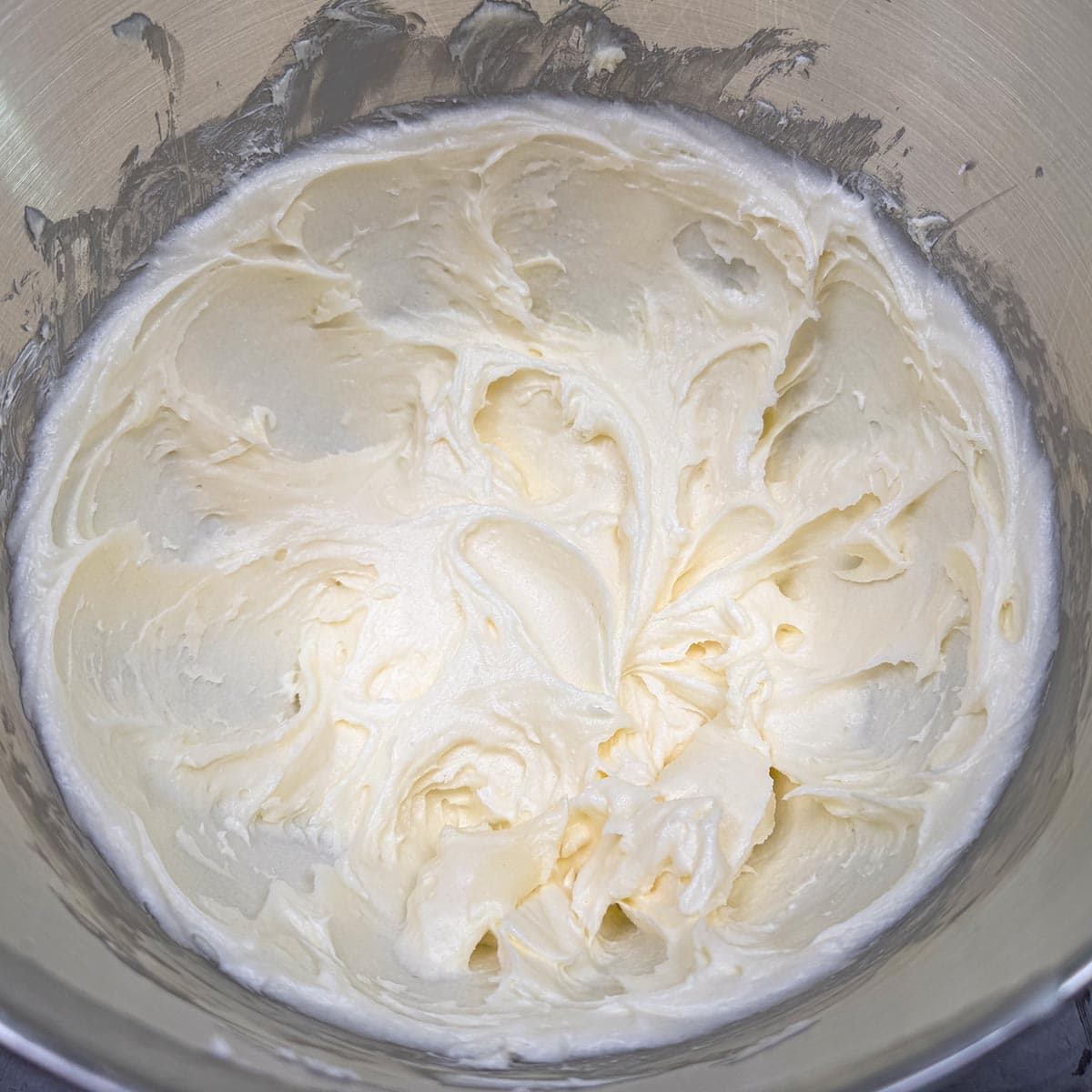 Soft swirls after mixing the sugar into the butter-cream cheese mixture.