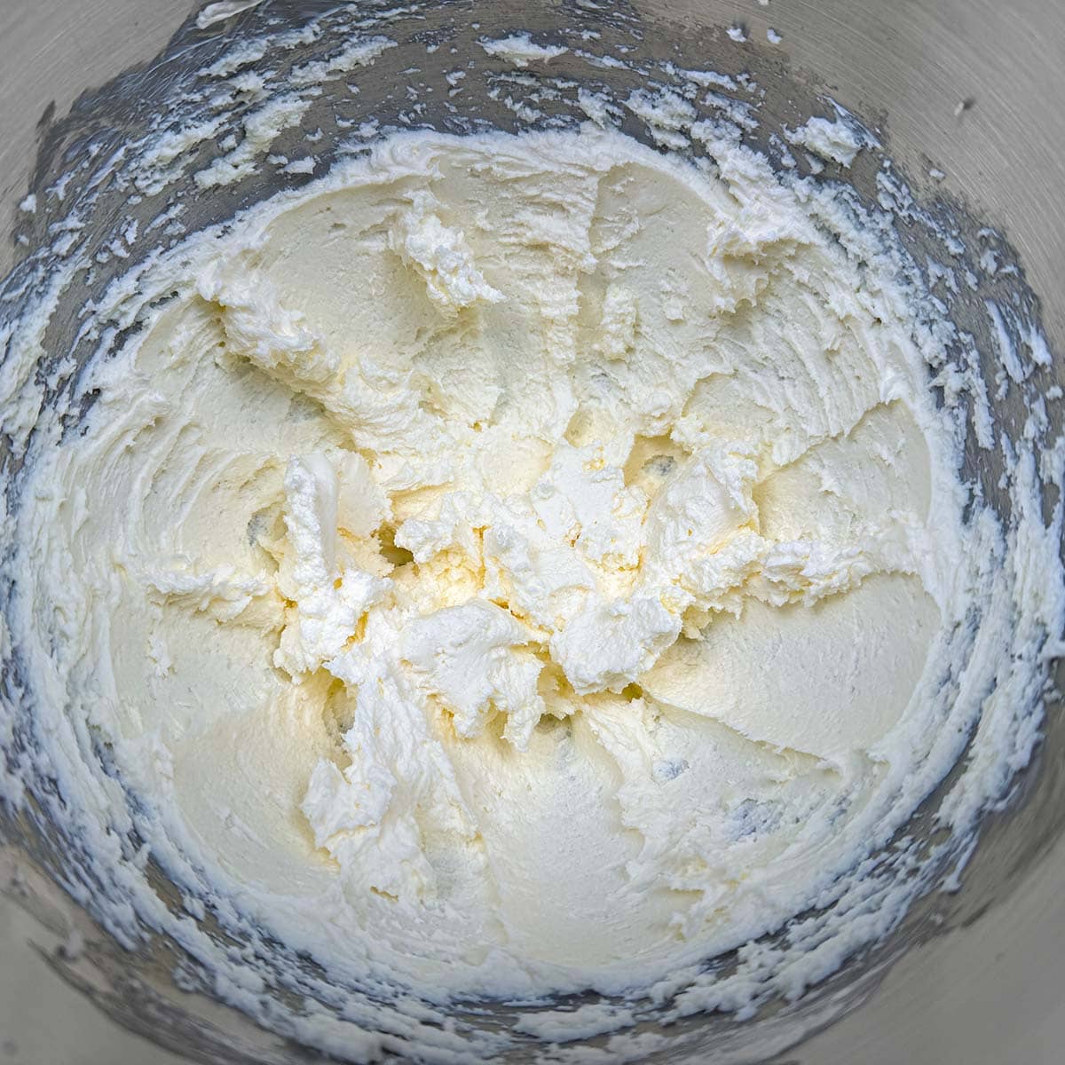 Butter and cream cheese mixed which looks a little grainy because of the cream cheese.