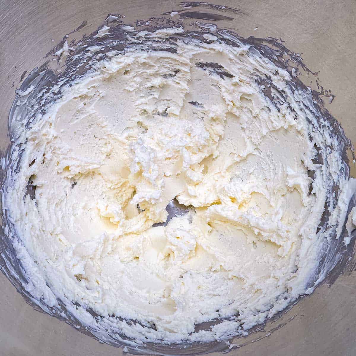 Butter and cream cheese mixed for about a minute to blend them together.