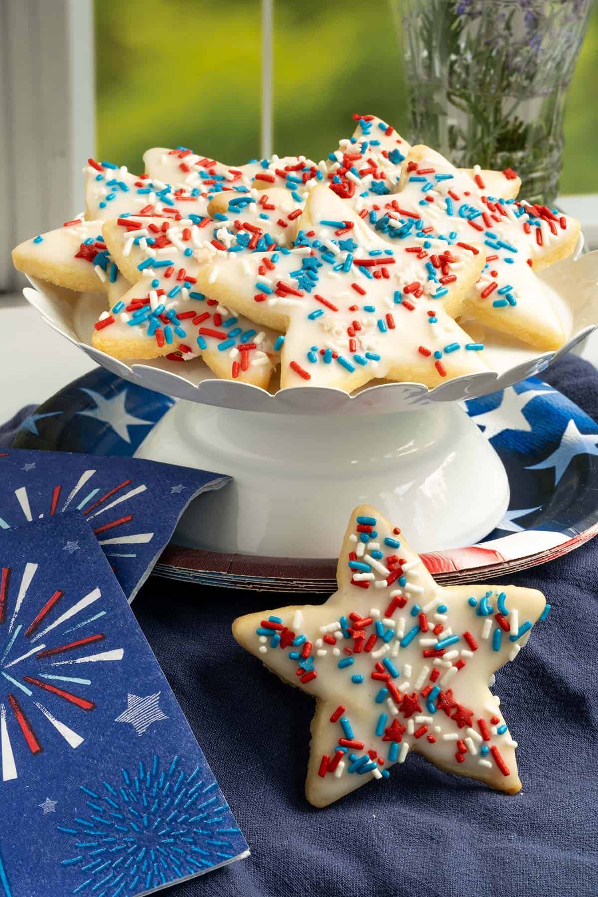 Honey almond glazed cookies surrounded by napkins and plate ready for the 4th of July.