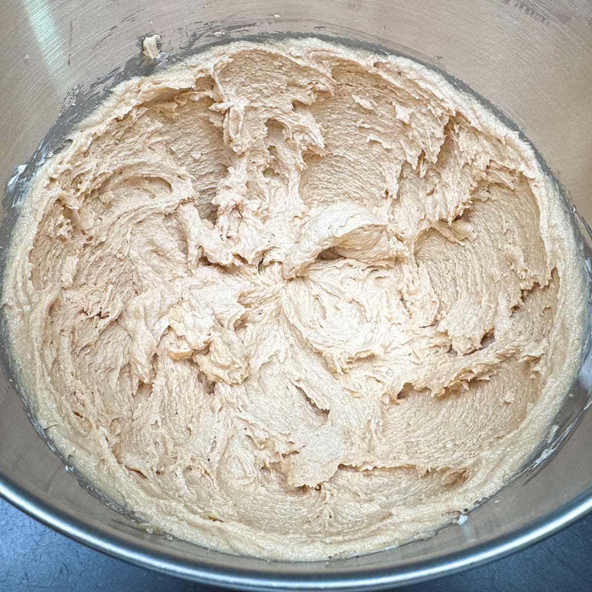 Creamy cookie dough after mixing the peanut butter into the sugar-butter-cream cheese mixture.