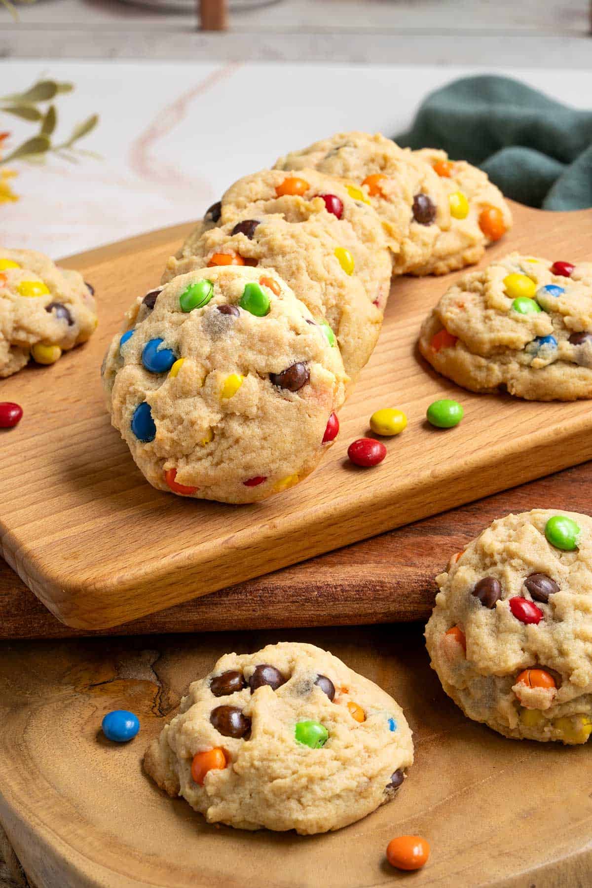 Completed Peanut Butter M&M and Reese's Pieces Cookies on a board.