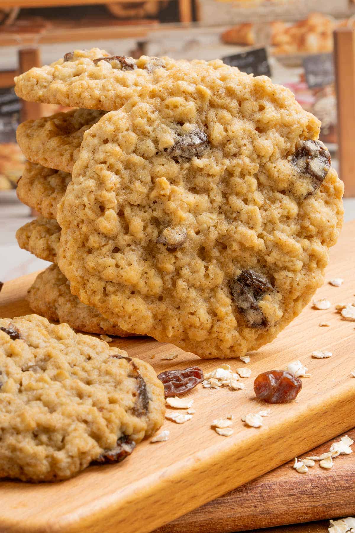 A stack and front view of Spiced Oatmeal Raisin Cookies on a board.