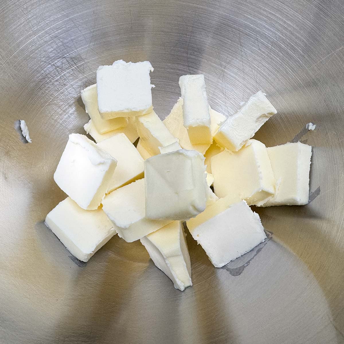 In the mixer bowl I added the cubed butter.