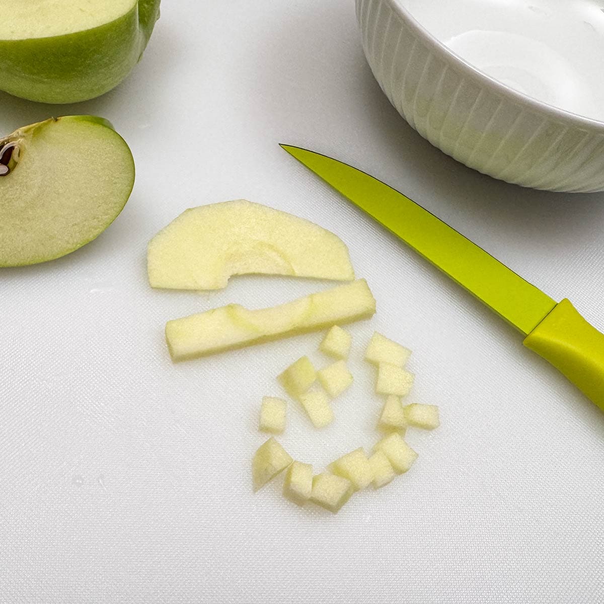 Dicing the granny smith apple.