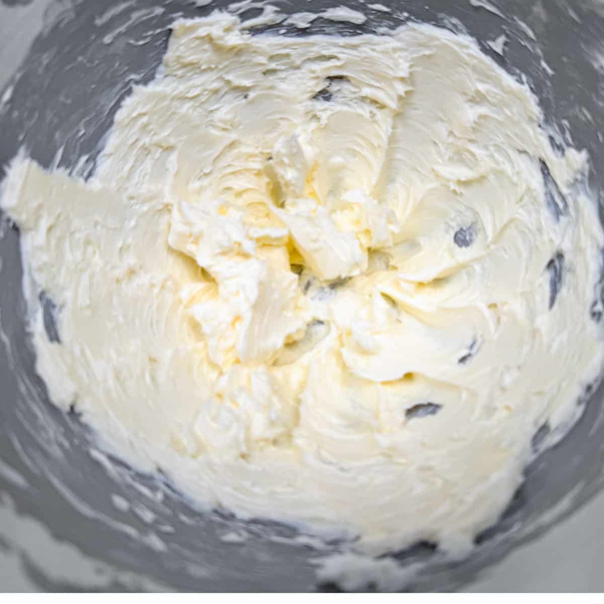 Creamed butter in a mixer bowl.