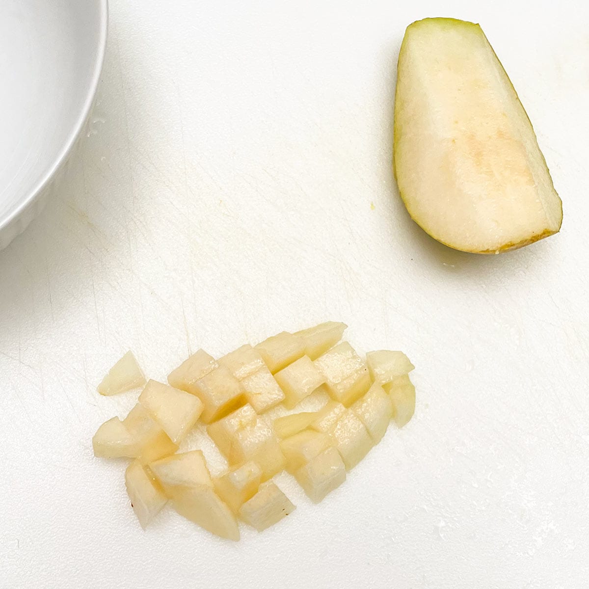 Diced pears on a cutting board.