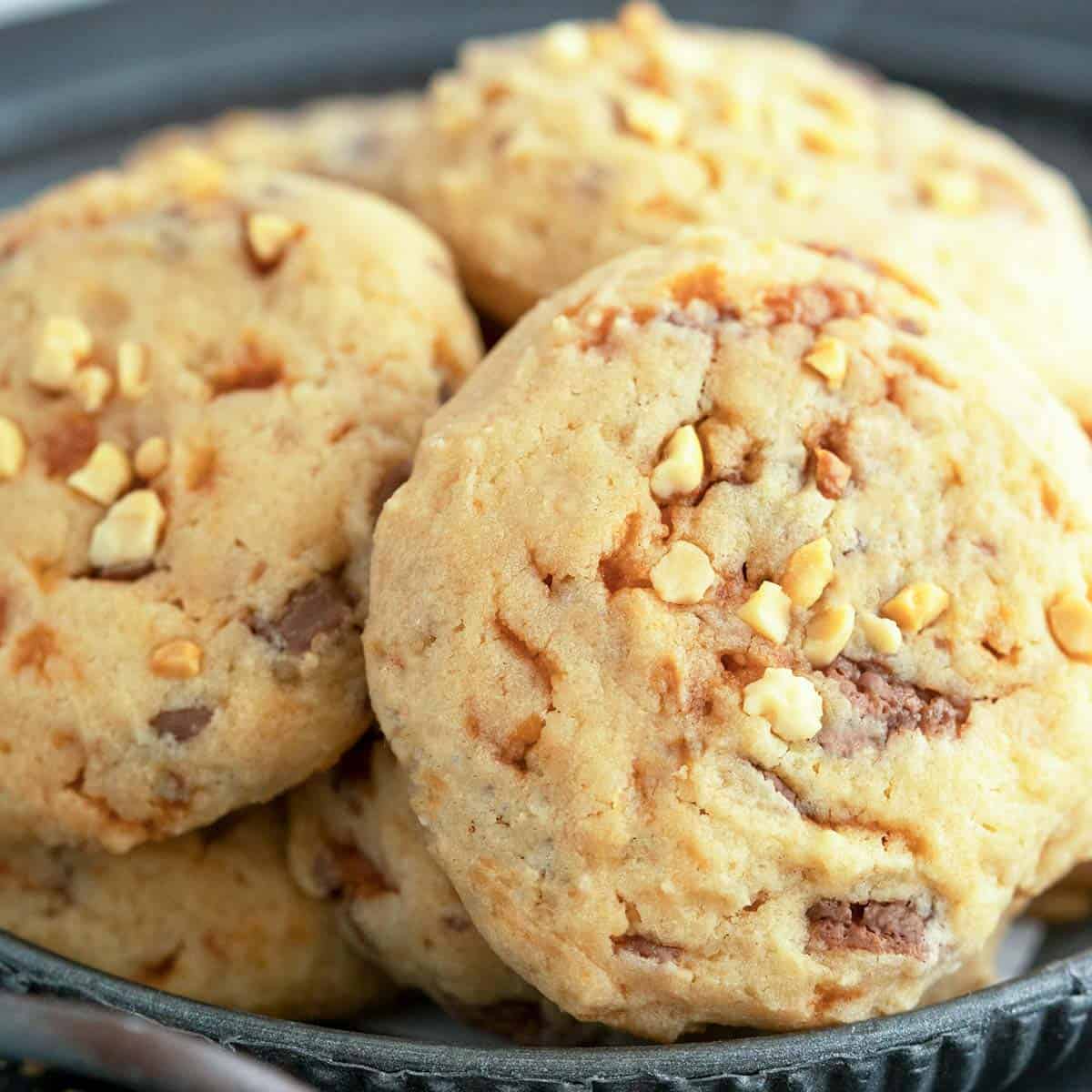 Peanut Butter with Butterfinger Cookies that have been flattened and peanuts on top.