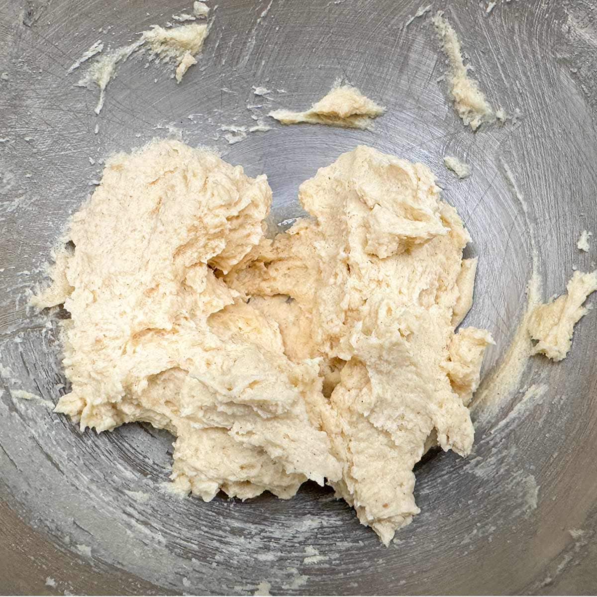 After adding and mixing the flour mixture to the wet ingredients in a mixer bowl.