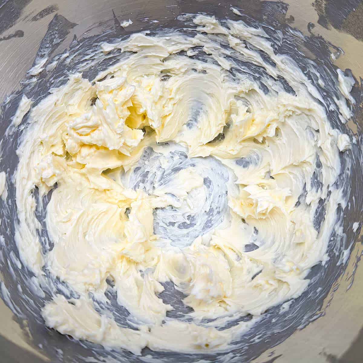 Soft peaks of butter after being creamed in a mixer.