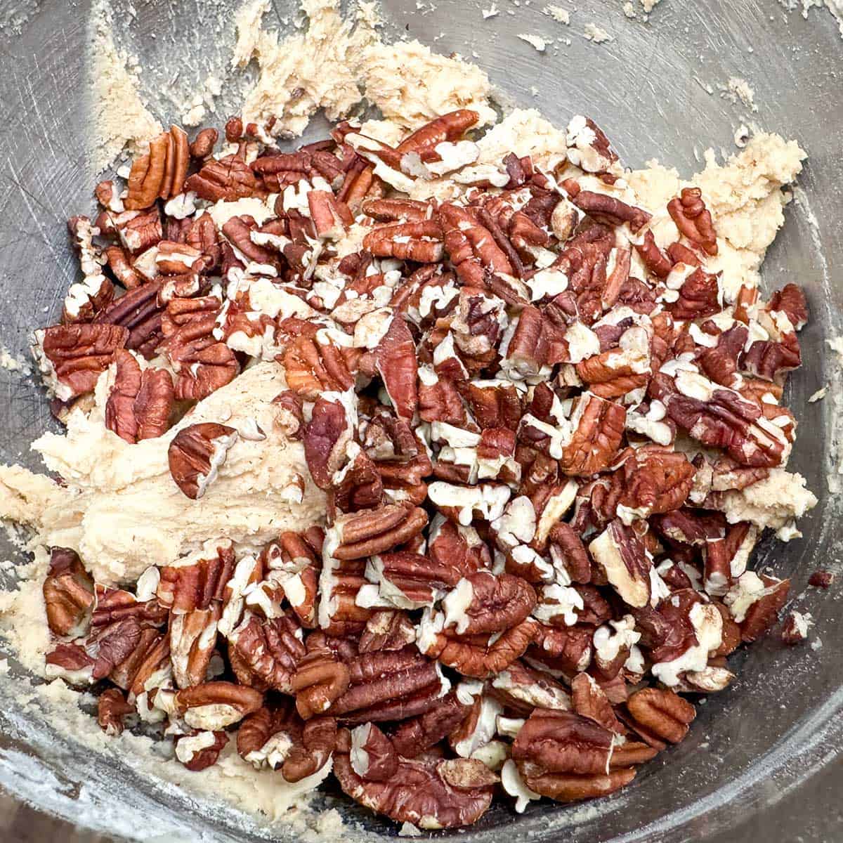 Have added flour mixture and now adding the chopped pecans.
