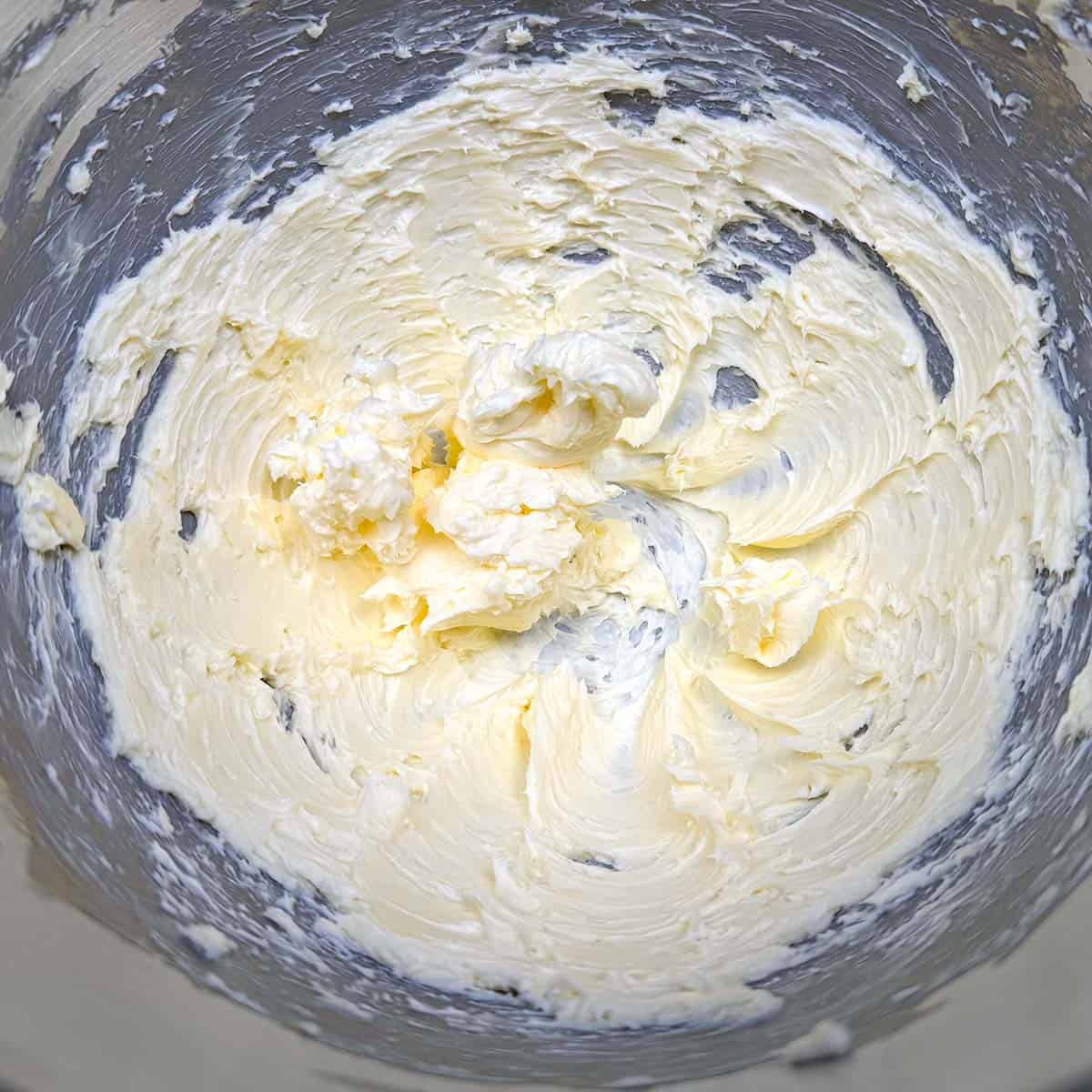 Creamed butter in a mixer bowl.