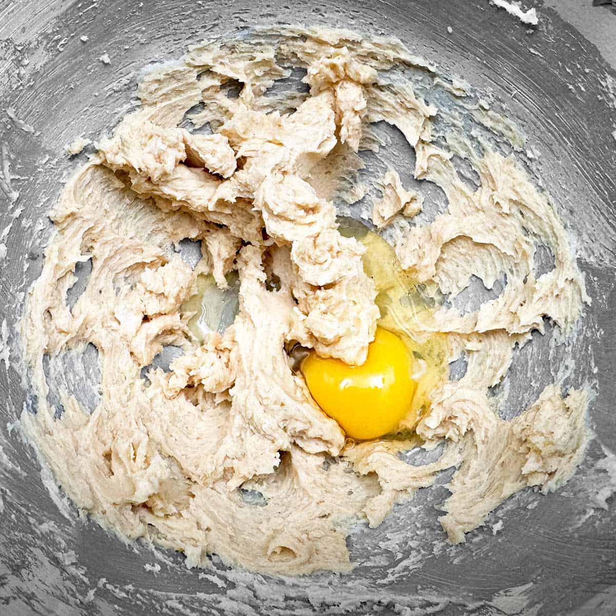 Adding the egg to the rest of the wet ingredients.